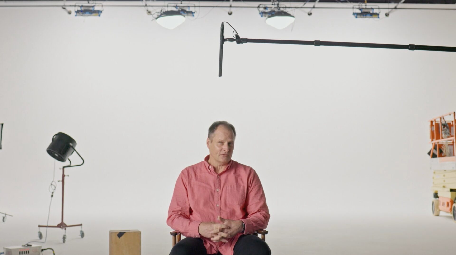 Interview subject on a white-cyc stage for Make It Here
