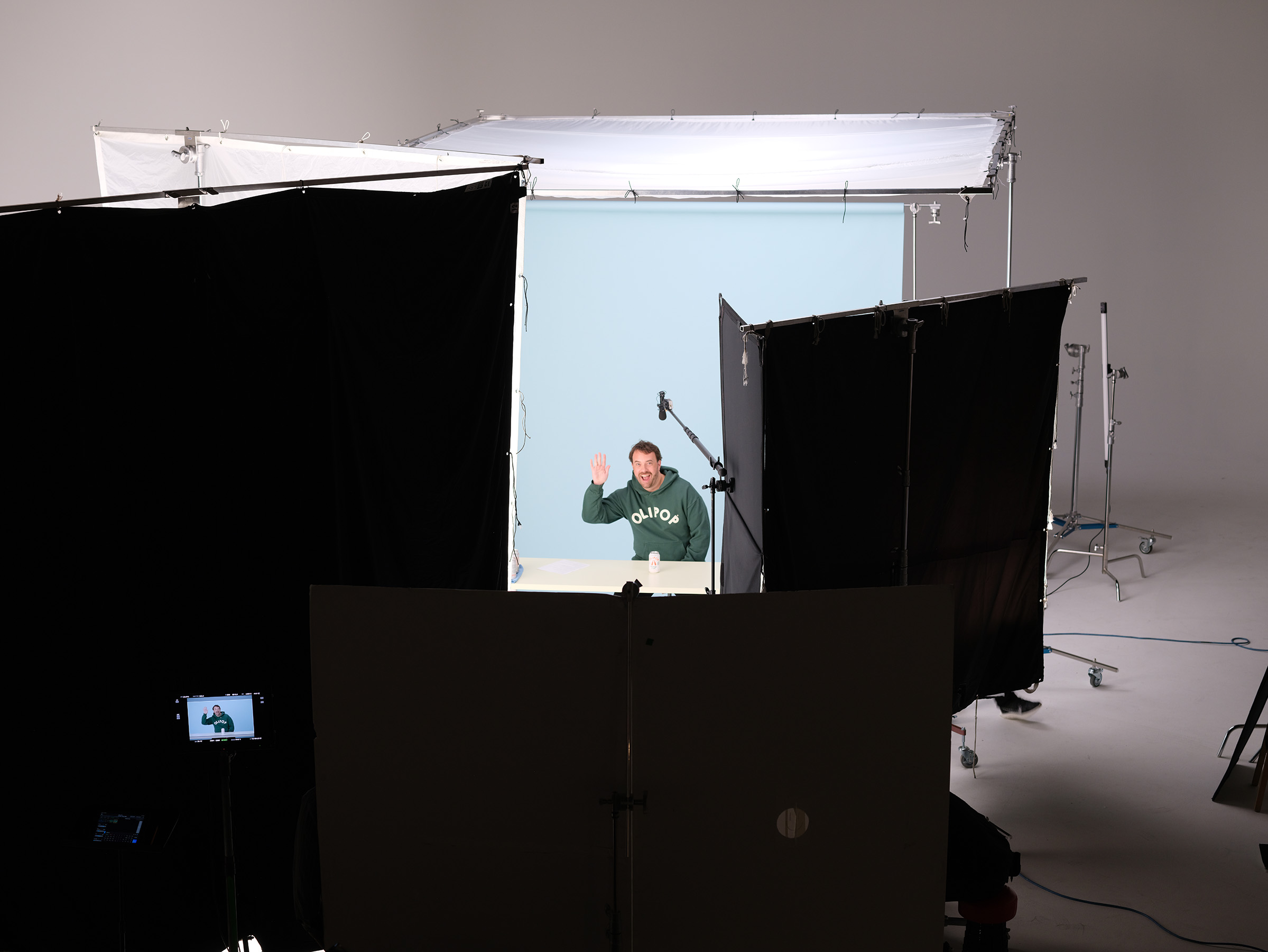 On-set portrait, blue background