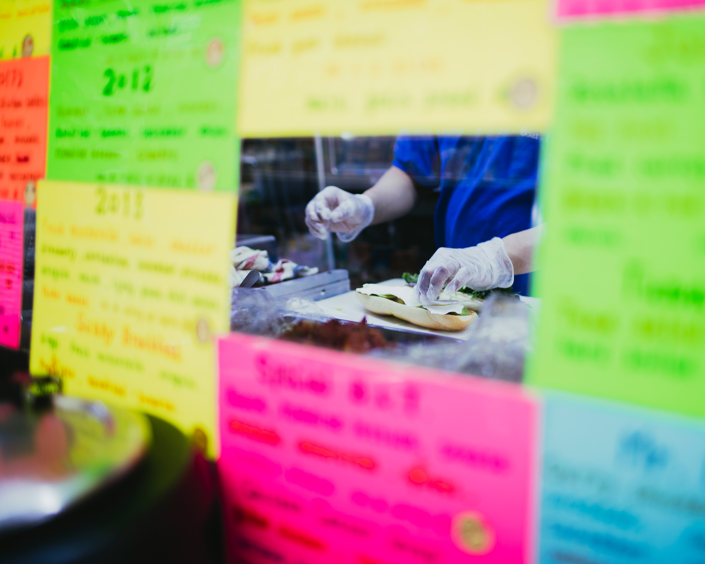 Sandwich viewed through sticky notes wall