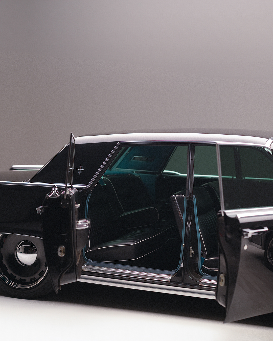 Black vintage car with doors open