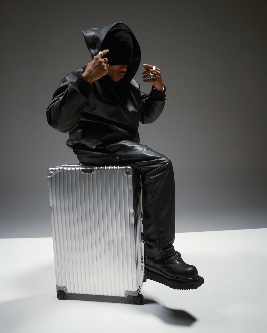 Rimowa suitcase with hooded leather jacket