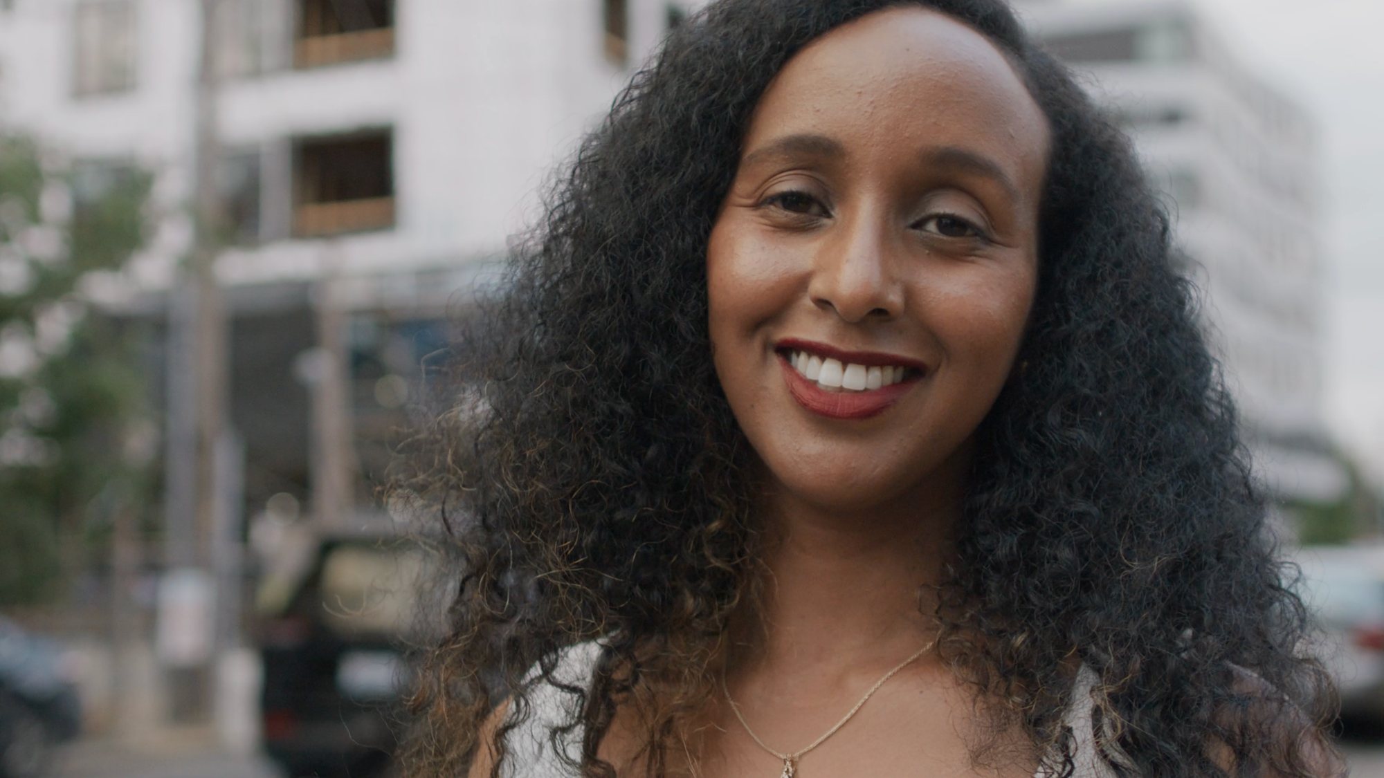 Close portrait of a woman smiling on a Portland street