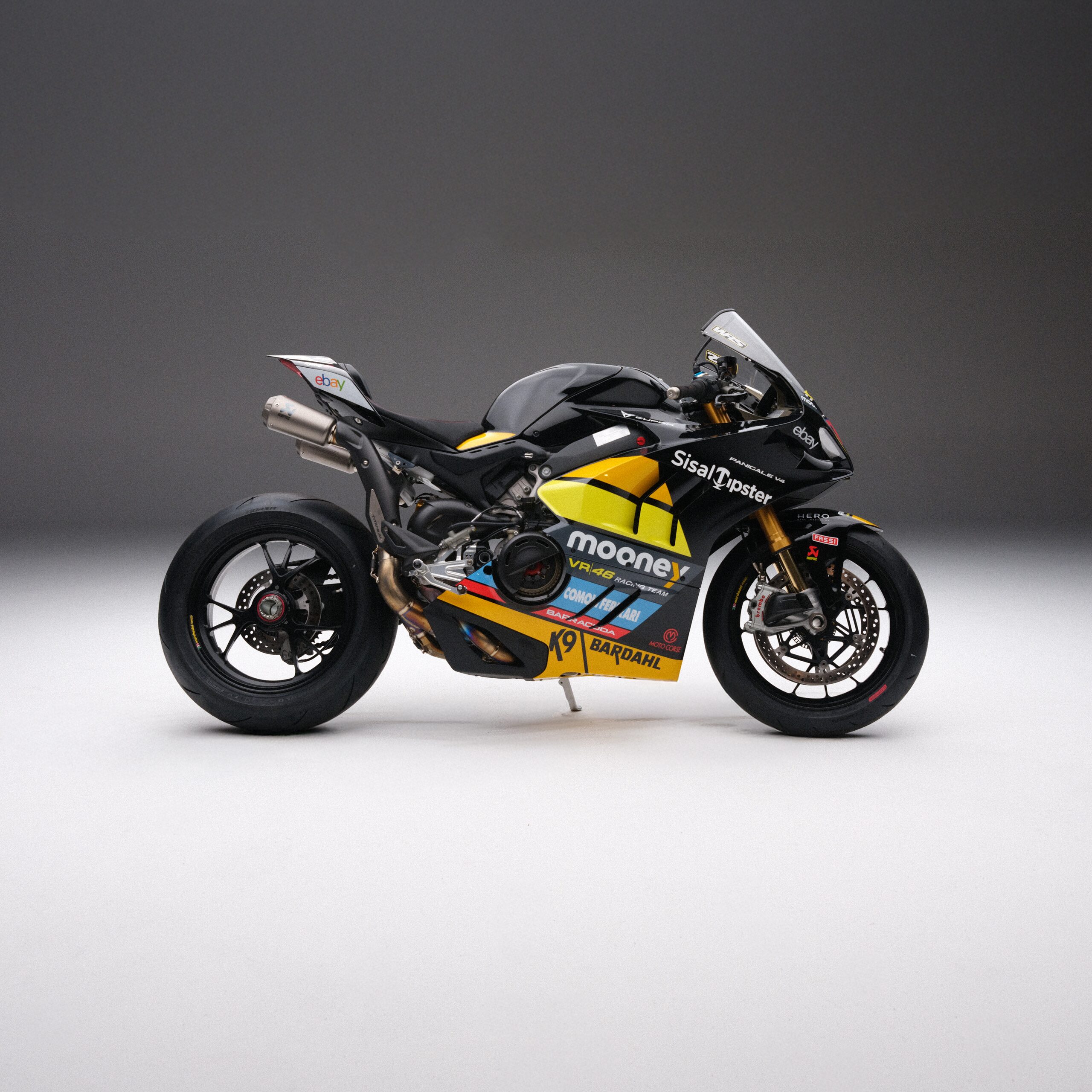 Yellow and black racing motorcycle on a studio seamless backdrop