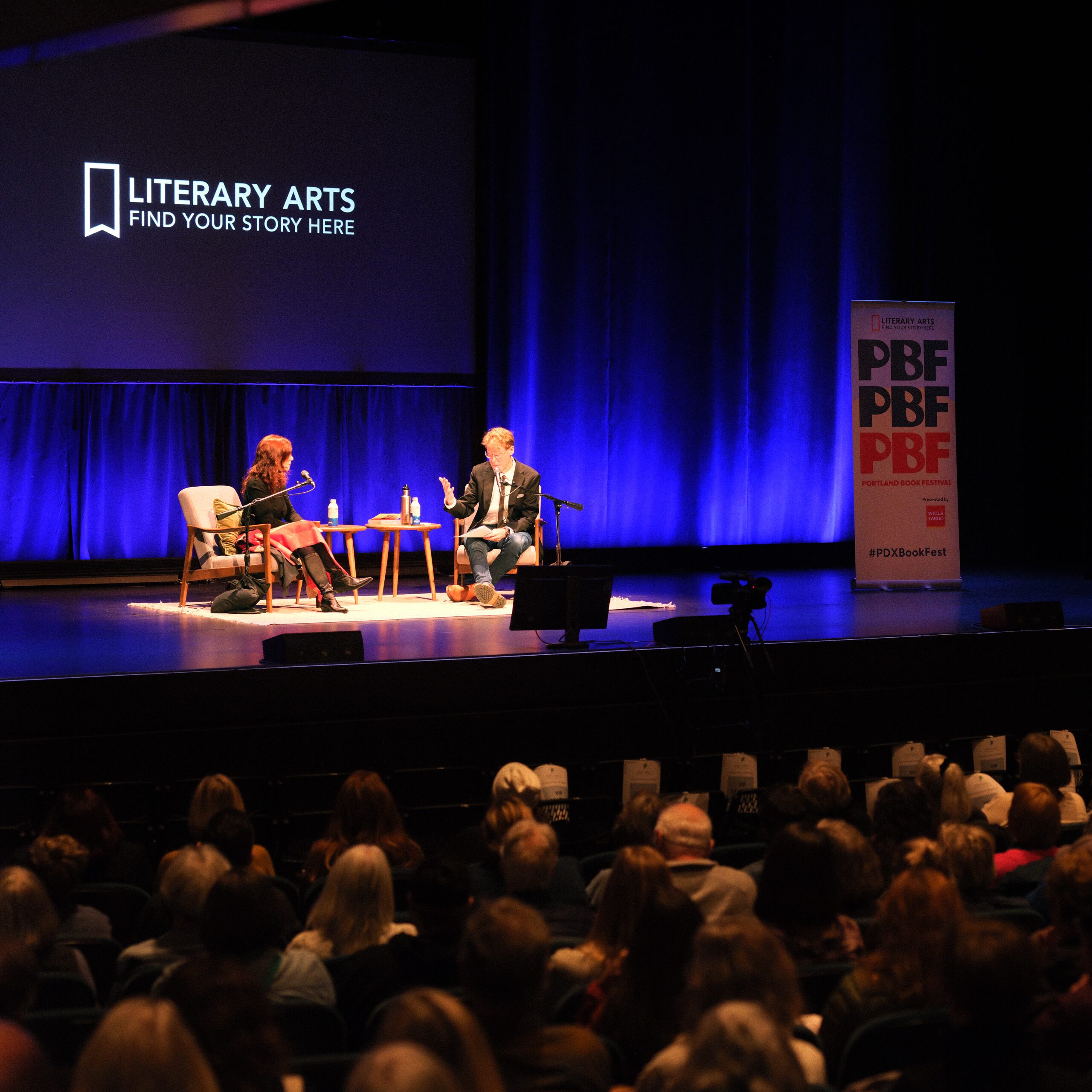 On-stage conversation under the Literary Arts backdrop