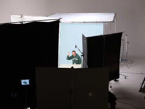 On-set portrait, blue background
