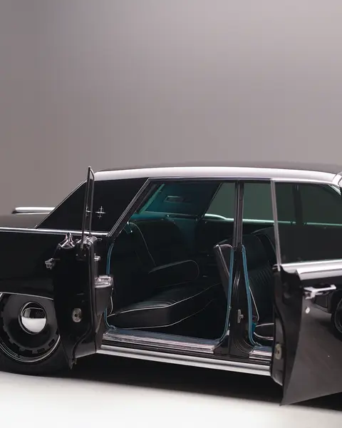 Black vintage car with doors open