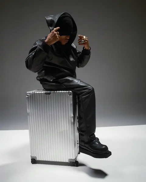 Rimowa suitcase with hooded leather jacket