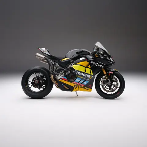Yellow and black racing motorcycle on a studio seamless backdrop
