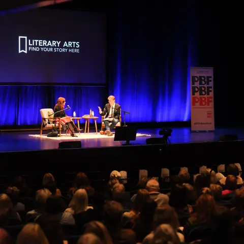 On-stage conversation under the Literary Arts backdrop